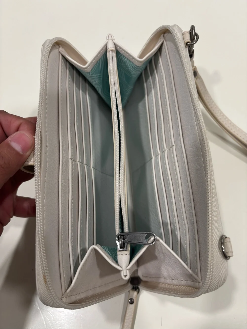 The Sak Light Cream Wristlet Clutch
